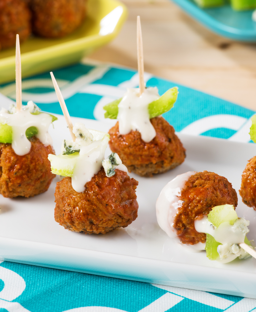 Meatballs on a toothpick with buffalo sauce and blue cheese